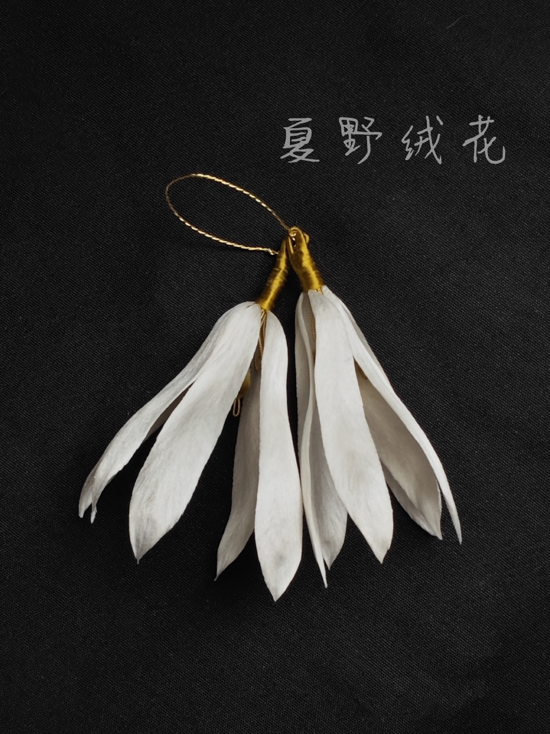 White champaca silk flower earrings by Xiaye Bloom